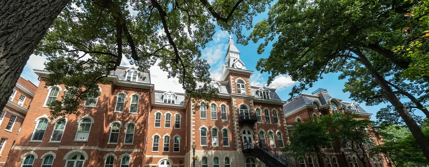 A photo of the beautiful and historic galaxy银河娱乐场app Hall, a large brick building with a clock tower.